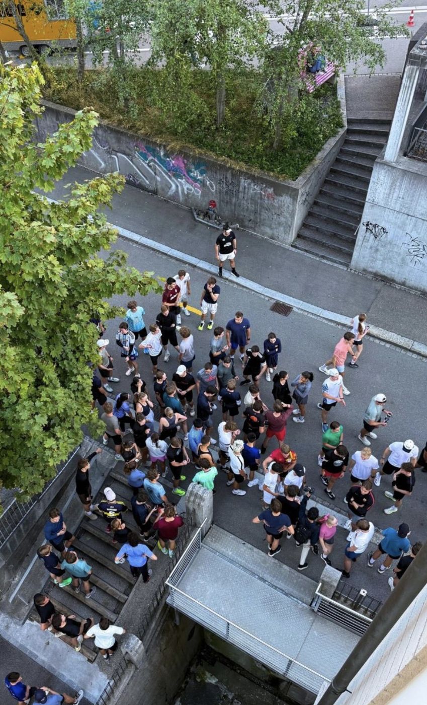 The group gathering on the stairs before the run, seen from above