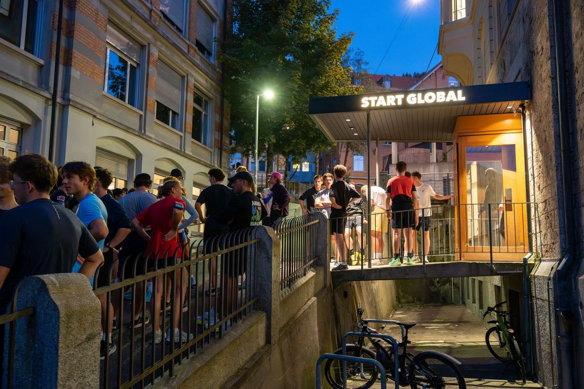 Runners gathering at the START Global entrance in the evening